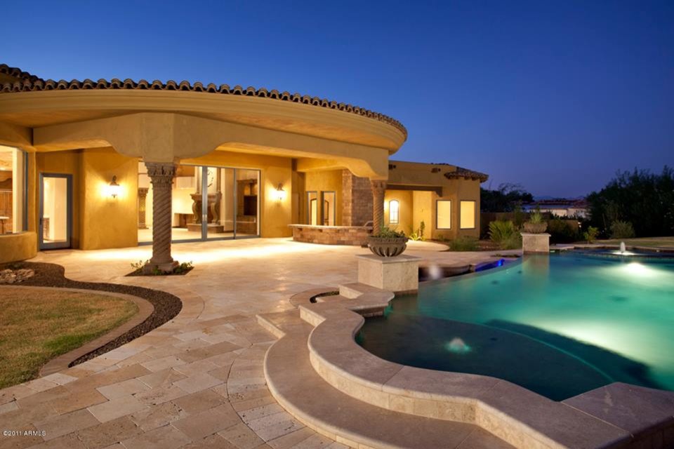 Inspiration for a backyard custom-shaped pool remodel in Phoenix