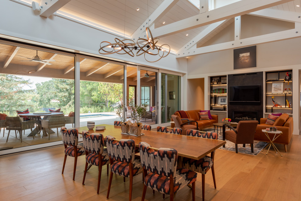 St. Andrews Napa CA Rebuild - This home in Napa off Silverado was rebuilt after burning down in the 2017 fires. Architect David Rulon, a former associate of Howard Backen, are known for this Napa Valley industrial modern farmhouse style. The great room has trussed ceiling and clerestory windows that flood the space with indirect natural light. Nano style doors opening to a covered screened in porch leading out to the pool. Metal fireplace surround and book cases as well as Bar shelving done by Wyatt Studio, moroccan CLE tile backsplash, quartzite countertops,