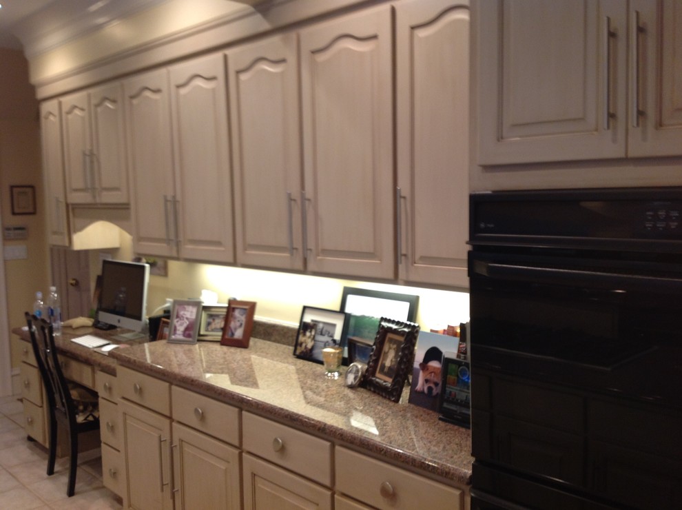Inspiration for a large transitional open concept kitchen remodel with raised-panel cabinets, beige cabinets, granite countertops and an island