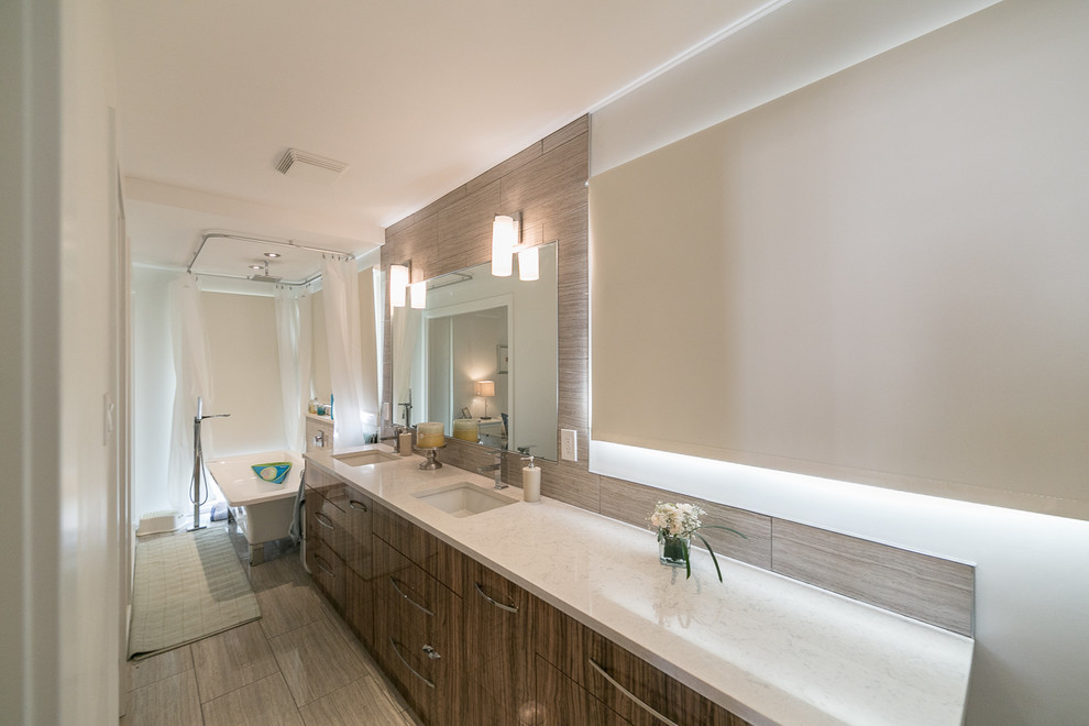 Mid-sized minimalist master beige tile and mosaic tile porcelain tile freestanding bathtub photo in Edmonton with an undermount sink, flat-panel cabinets, brown cabinets, laminate countertops, a one-piece toilet and white walls