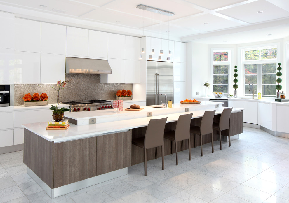 Design ideas for an expansive modern l-shaped open plan kitchen in Other with an undermount sink, flat-panel cabinets, white cabinets, granite benchtops, metallic splashback, metal splashback, stainless steel appliances, marble floors, with island and white floor.