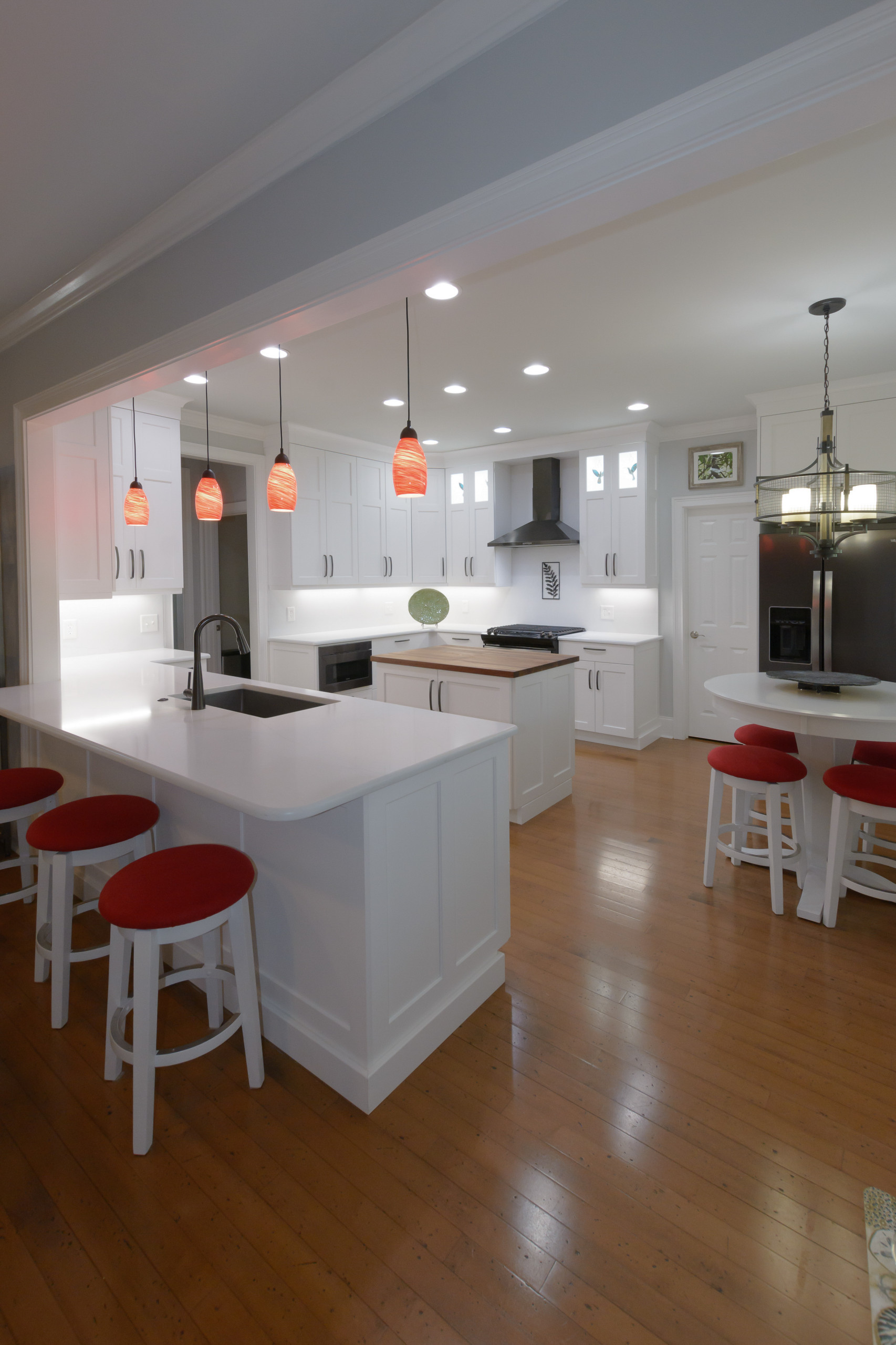 Pawley's Island modern white kitchen with butcher block island