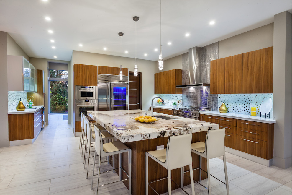 Design ideas for a contemporary kitchen in Seattle with an undermount sink, flat-panel cabinets, medium wood cabinets, metallic splashback, stainless steel appliances, with island, grey floor and metal splashback.