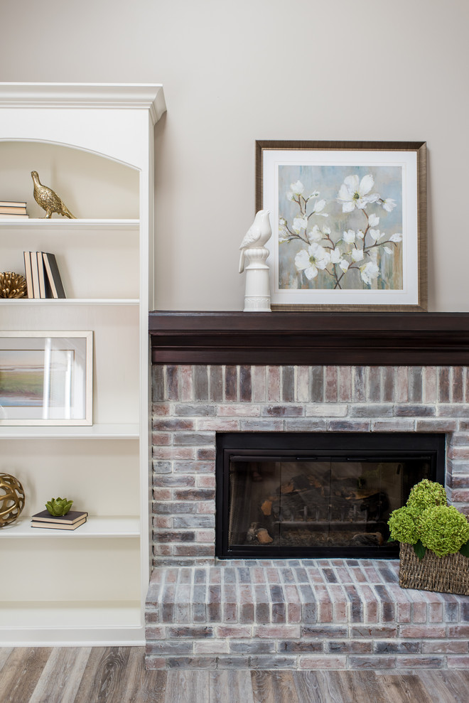 Inspiration for a mid-sized modern formal living room in Indianapolis with beige walls, a standard fireplace, a brick fireplace surround and no tv.