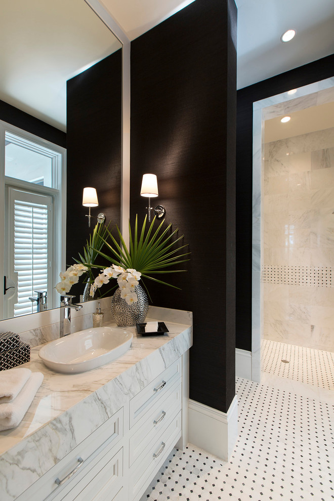Inspiration for a transitional bathroom in Miami with a vessel sink, black walls and white cabinets.