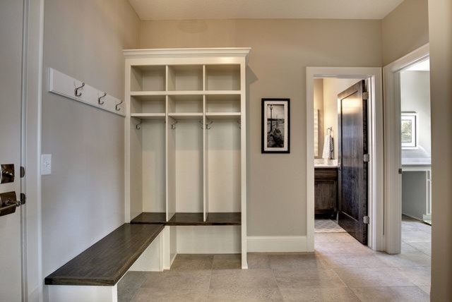Inspiration for a mid-sized transitional mudroom in Minneapolis with grey walls, ceramic floors, a single front door and a white front door.