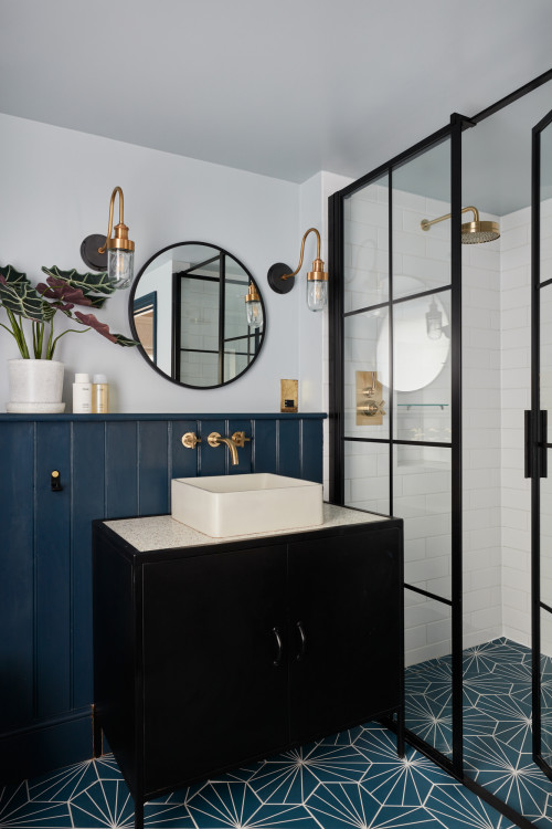 Single Vessel Sink Vanity with Blue V-groove Backsplash and Gold Accents