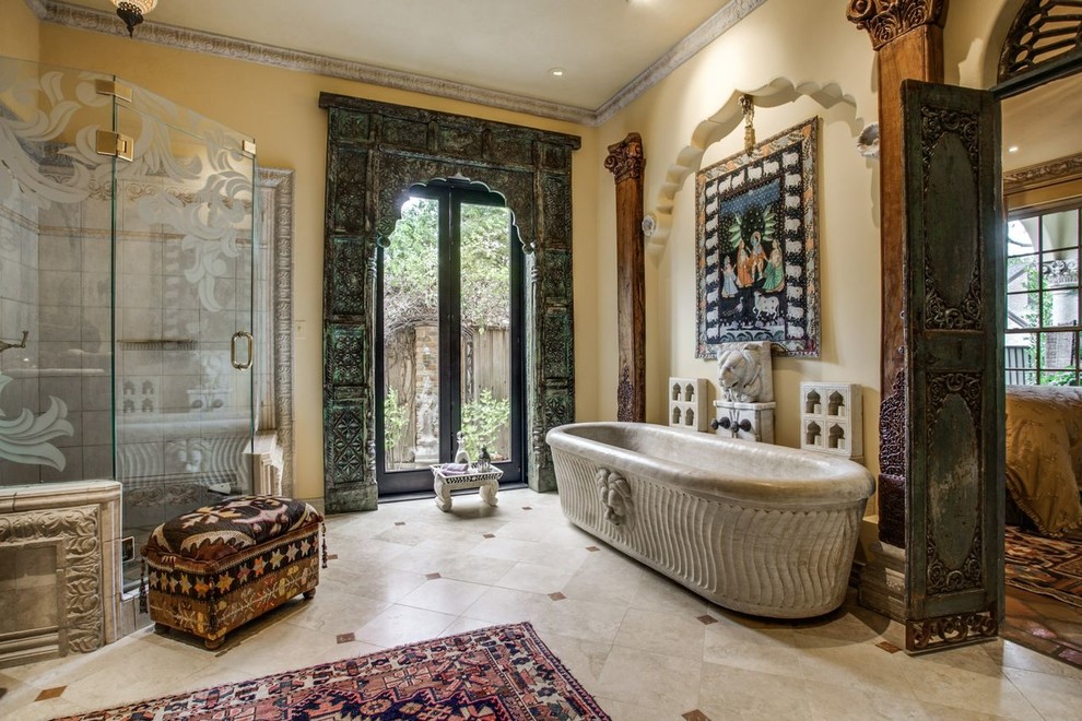 Design ideas for a large eclectic master bathroom in Dallas with a freestanding tub, a corner shower, marble floors, beige walls and beige floor.