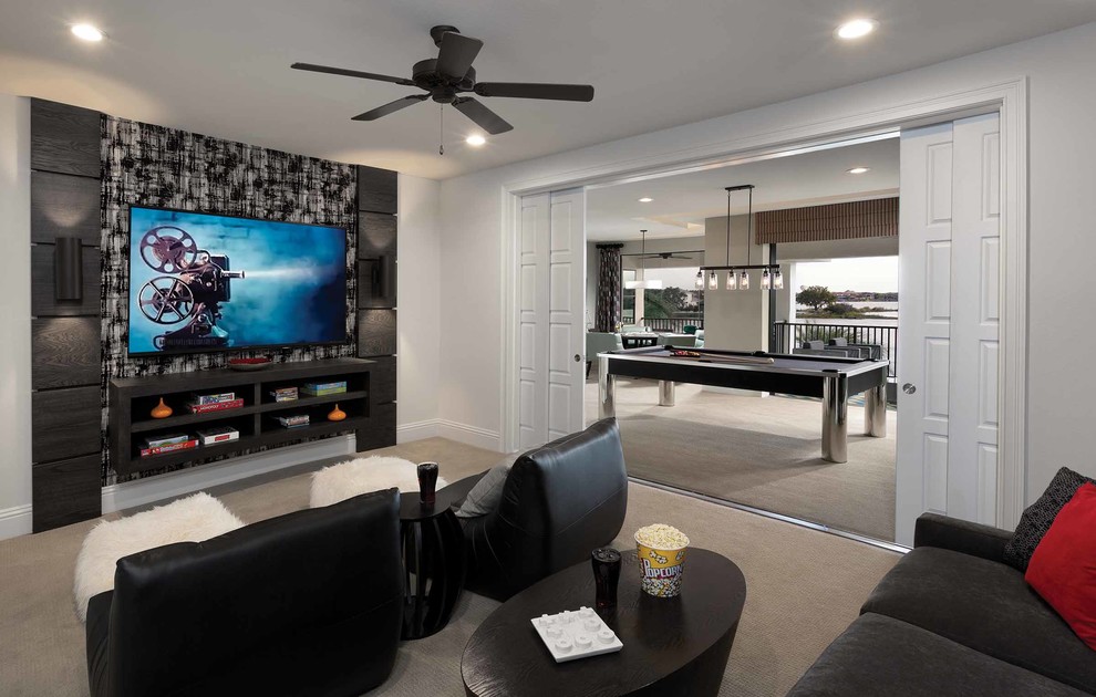 Photo of a mid-sized contemporary open concept family room in Orlando with a game room, white walls, carpet, no fireplace and a wall-mounted tv.