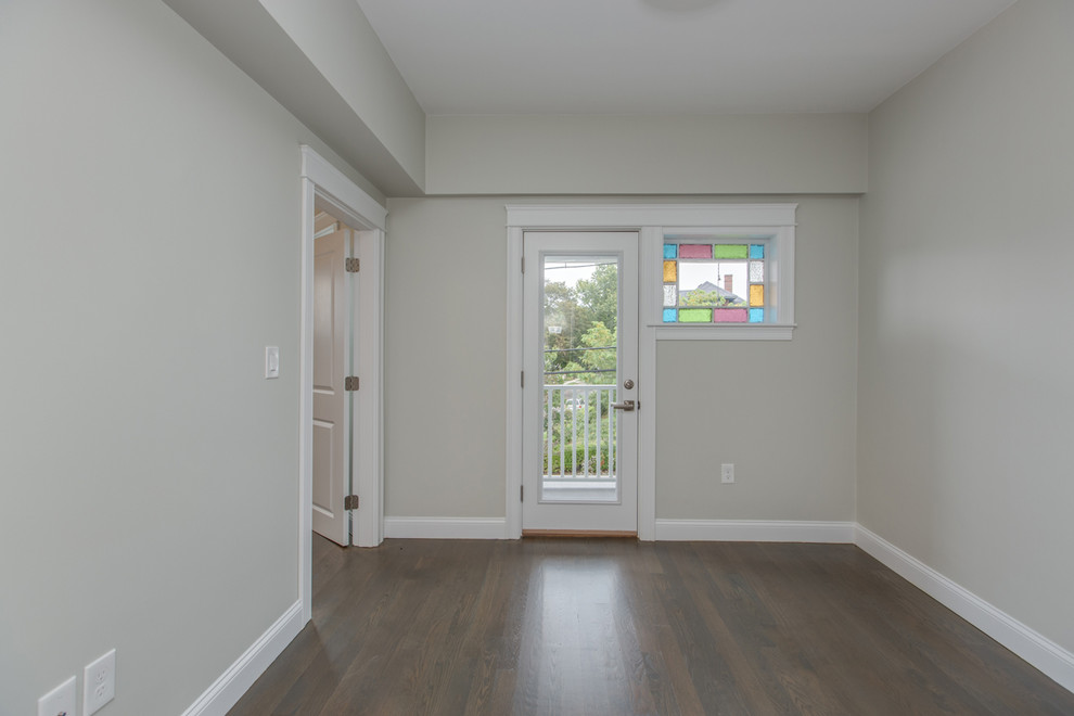 Mid-sized transitional dark wood floor and brown floor front door photo in Boston with beige walls and a glass front door