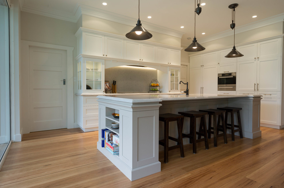 Photo of a transitional kitchen in Other with a peninsula.
