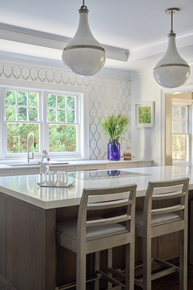Enclosed kitchen - large transitional u-shaped dark wood floor and brown floor enclosed kitchen idea in New York with an undermount sink, flat-panel cabinets, quartz countertops, white backsplash, mosaic tile backsplash, stainless steel appliances, an island, white countertops and dark wood cabinets