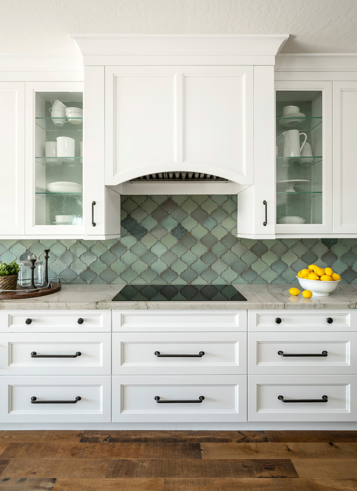 Mid-sized transitional l-shaped dark wood floor and brown floor open concept kitchen photo in Phoenix with an undermount sink, shaker cabinets, white cabinets, quartzite countertops, blue backsplash, terra-cotta backsplash, stainless steel appliances, an island and white countertops