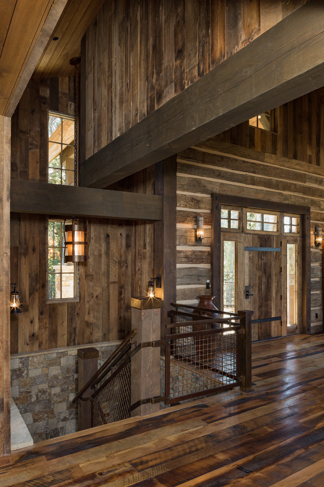 Mountain style wooden u-shaped metal railing staircase photo with wooden risers