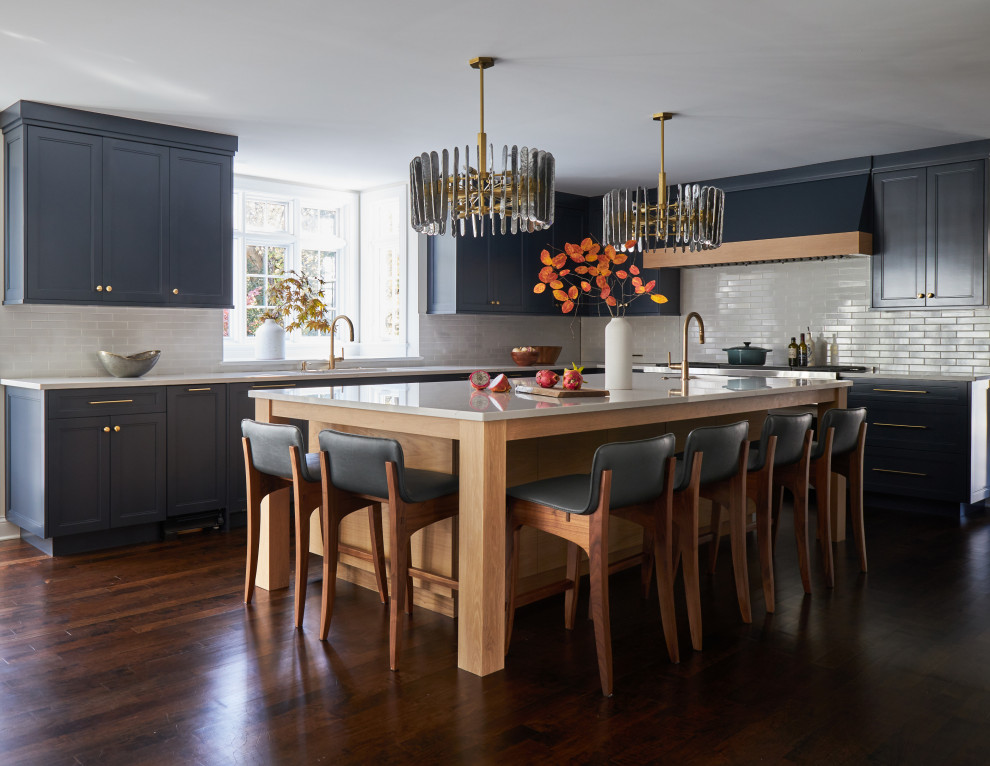 Eat-in kitchen - large transitional l-shaped dark wood floor and brown floor eat-in kitchen idea in Chicago with a single-bowl sink, recessed-panel cabinets, blue cabinets, quartz countertops, white backsplash, ceramic backsplash, paneled appliances, an island and white countertops