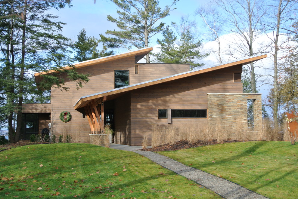 This is an example of a contemporary exterior in Grand Rapids with wood siding.