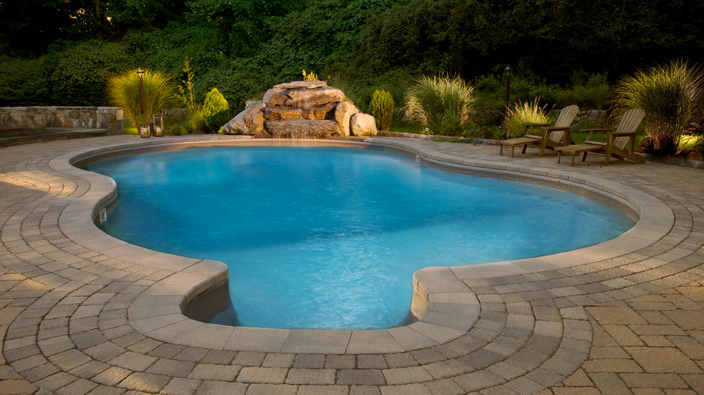 This is an example of a mid-sized contemporary pool in New York.