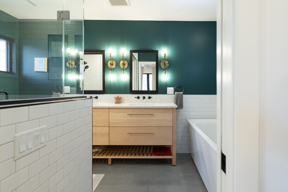 Transitional green tile and subway tile ceramic tile, gray floor and double-sink freestanding bathtub photo in Other with flat-panel cabinets, light wood cabinets and a freestanding vanity