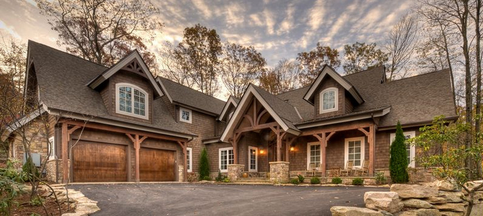 Large arts and crafts one-storey brown exterior in Charlotte with wood siding.