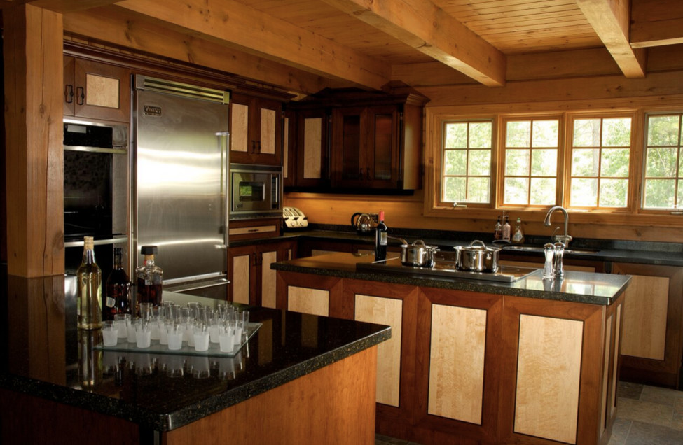 Large mountain style galley light wood floor open concept kitchen photo in Boston with an undermount sink, shaker cabinets, dark wood cabinets, granite countertops, stainless steel appliances and an island