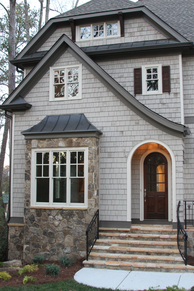 Inspiration for a large traditional two-storey grey exterior in Atlanta with wood siding.