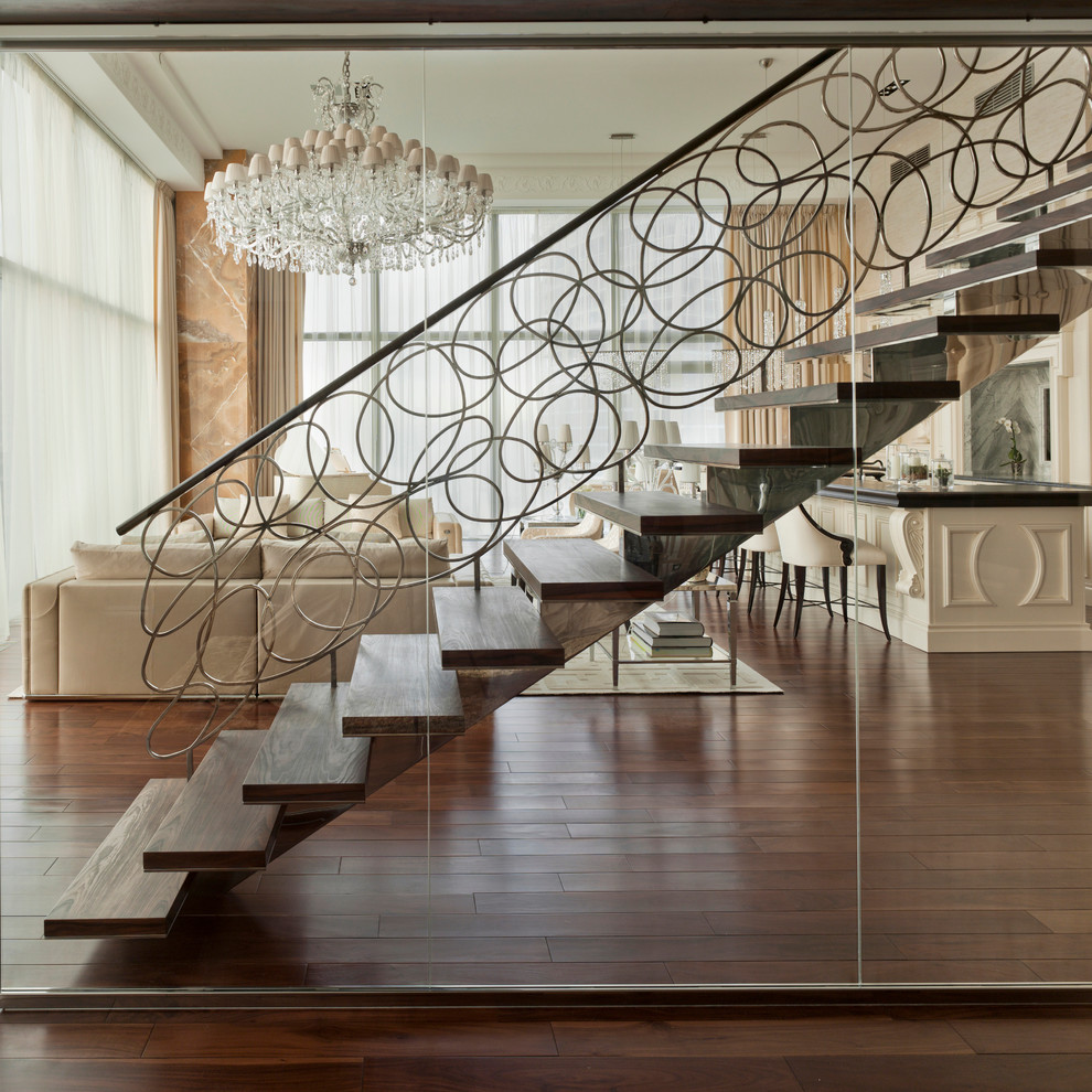 Photo of an expansive contemporary wood straight staircase in New York with open risers.