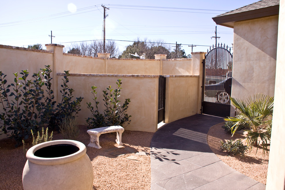 Design ideas for a mediterranean side yard patio in Austin with decomposed granite.