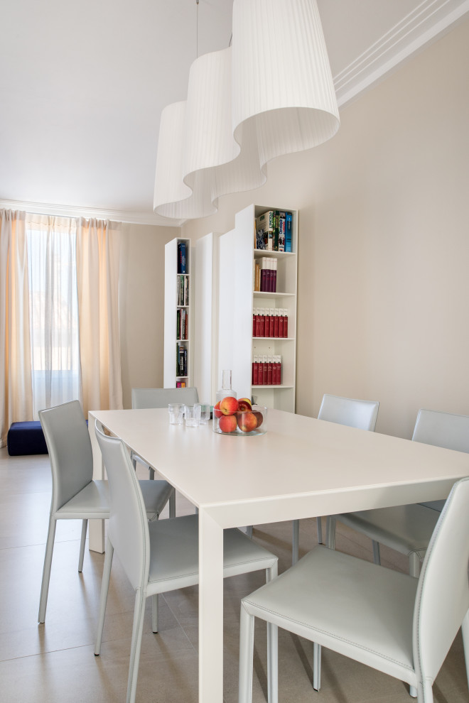 Photo of a large contemporary dining room in Marseille with limestone flooring and white floors.