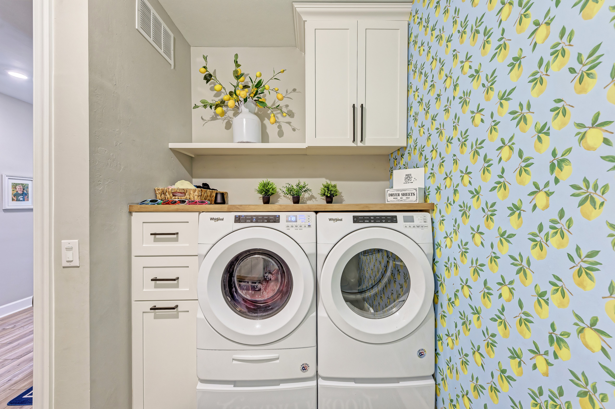 This family with 3 kids wanted organization in the laundry room and a personalized spot for each kid to hang their backpack and put their items. We designed this laundry room to serve that purpose, be