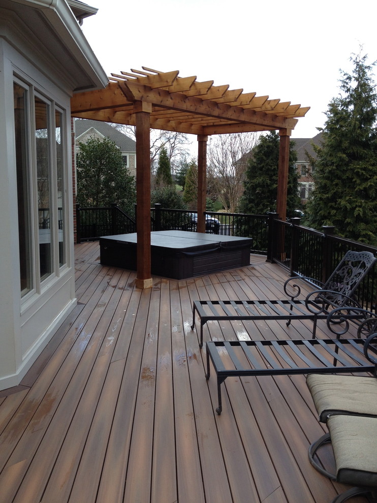 Photo of a traditional deck in DC Metro with a pergola.