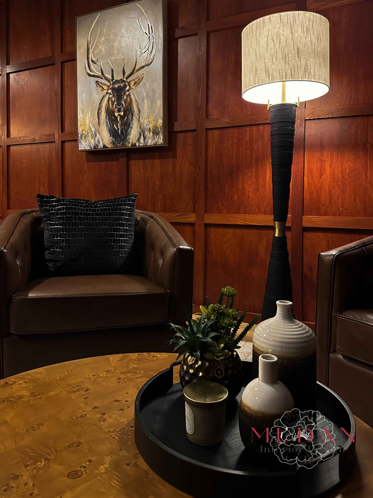 Example of a large medium tone wood floor and brown floor basement design with a standard fireplace