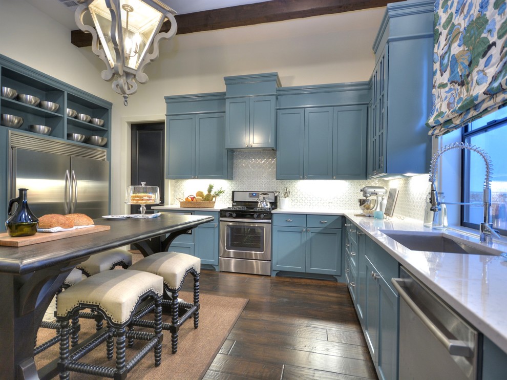 Inspiration for a transitional u-shaped separate kitchen in Austin with an undermount sink, shaker cabinets, blue cabinets, white splashback, stainless steel appliances, dark hardwood floors and with island.