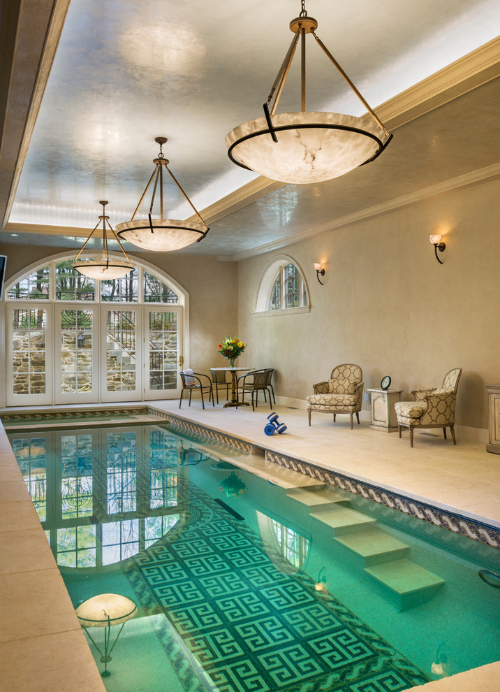 This is an example of a small traditional indoor pool in Philadelphia with a pool house.