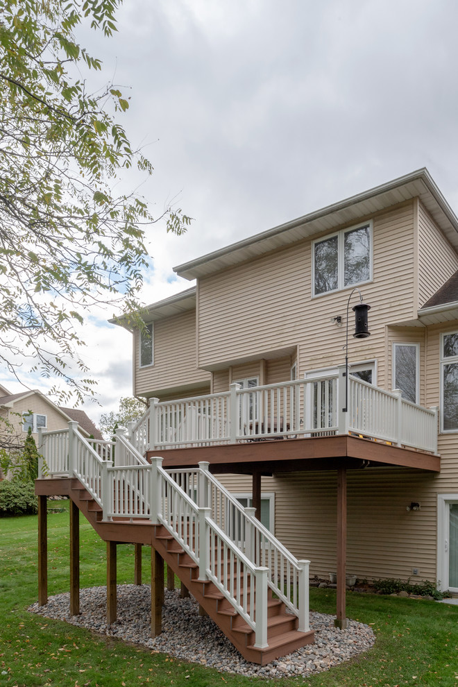 Mid-sized transitional backyard deck photo with no cover