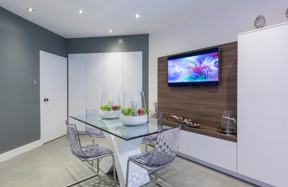 Photo of a mid-sized contemporary kitchen/dining combo in West Midlands with grey walls.