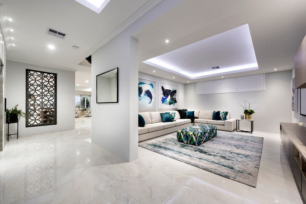 This is an example of a large contemporary open concept home theatre in Perth with white walls, porcelain floors, a wall-mounted tv and white floor.