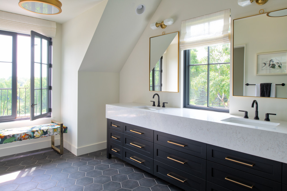This is an example of a large transitional 3/4 bathroom in Minneapolis with shaker cabinets, black cabinets, beige walls, an undermount sink, grey floor and white benchtops.