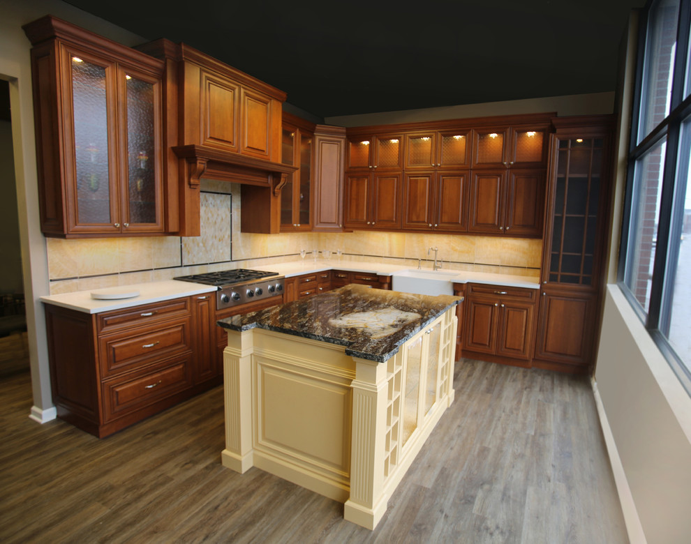 Design ideas for a small traditional l-shaped separate kitchen in Detroit with a farmhouse sink, yellow splashback, medium hardwood floors, with island, grey floor, raised-panel cabinets, dark wood cabinets, onyx benchtops, marble splashback, panelled appliances, black benchtop and exposed beam.