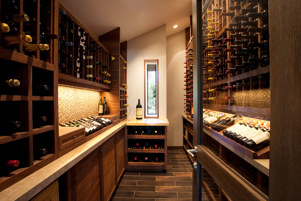 Inspiration for an expansive modern wine cellar in Santa Barbara with ceramic floors and display racks.