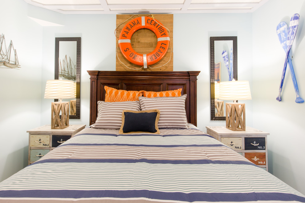 Design ideas for a mid-sized beach style guest bedroom in Philadelphia with blue walls, vinyl floors and brown floor.