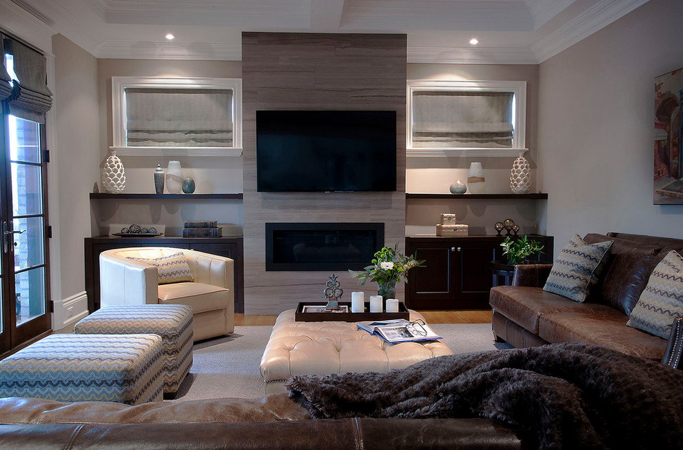 Design ideas for a transitional open concept family room in Toronto with medium hardwood floors, a ribbon fireplace, a stone fireplace surround and a wall-mounted tv.