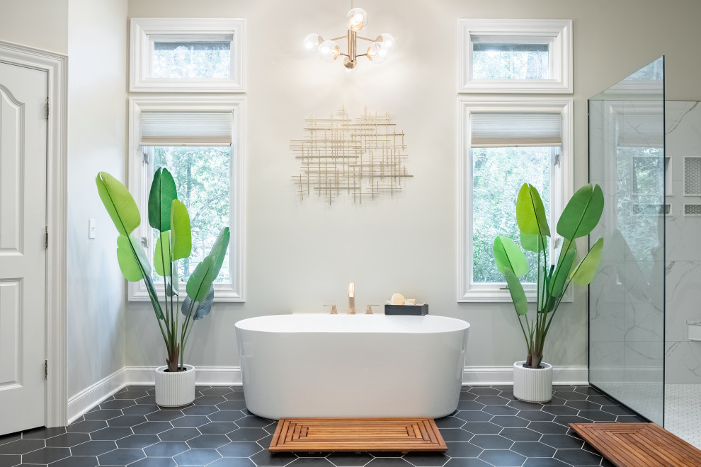 Design ideas for an expansive classic ensuite bathroom in Columbus with a freestanding bath, a built-in shower, grey walls, black floors, an open shower, an enclosed toilet and a built in vanity unit.