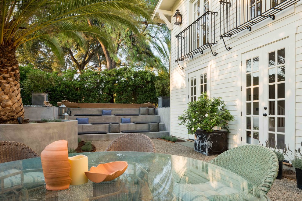 Inspiration for an expansive country front yard patio in Santa Barbara with a fire feature, concrete pavers and a pergola.