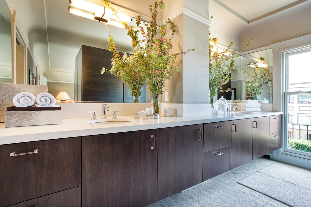 Inspiration for a contemporary bathroom in San Francisco with an undermount sink, flat-panel cabinets and dark wood cabinets.