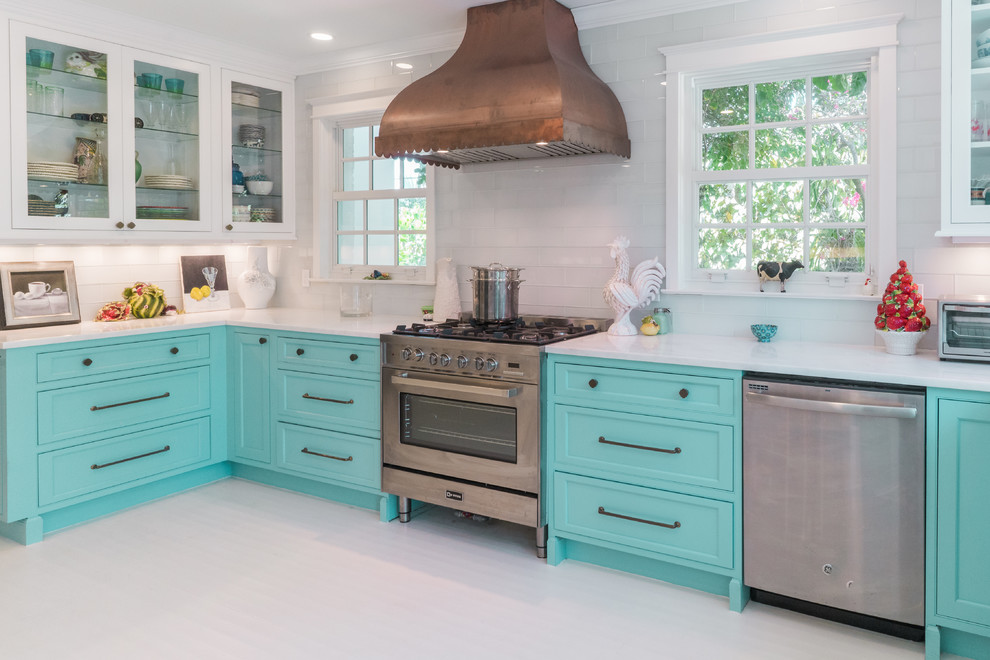Photo of a tropical kitchen in Other with beaded inset cabinets, turquoise cabinets, marble benchtops, painted wood floors and white floor.
