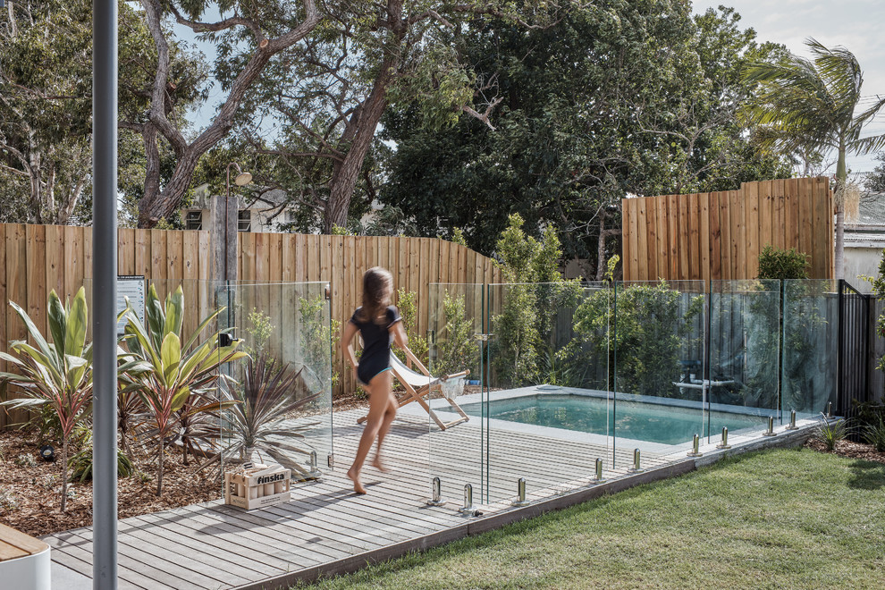 Design ideas for a beach style backyard rectangular pool in Gold Coast - Tweed with decking.