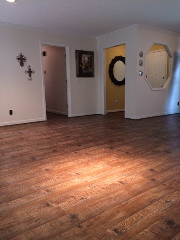 Photo of a small transitional formal enclosed living room in Atlanta with bamboo floors and no tv.