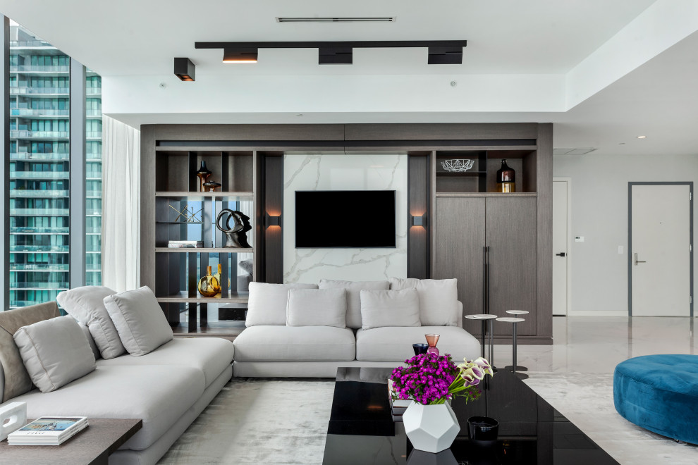 Photo of a large modern formal open concept living room in Miami with beige walls, marble floors, no fireplace, a built-in media wall, white floor and wallpaper.