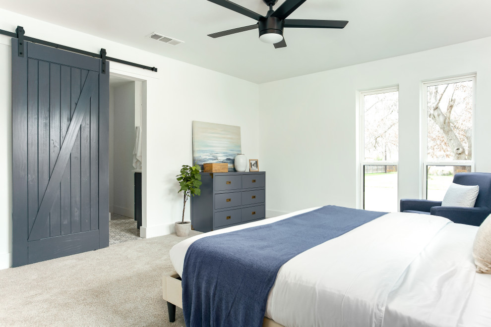 This is an example of a mid-sized transitional bedroom in Dallas with white walls.
