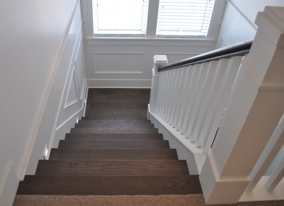 Inspiration for a transitional wood staircase in Vancouver with wood risers.